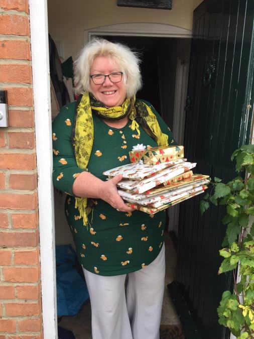 Margo carrying some presents